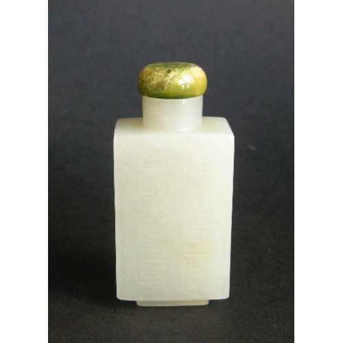 Rectangular shaped light green jade snuff bottle carved on each side with shou signs
